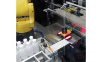 The robot will pick the complete pack pattern and hold it over the camera to record the ID numbers of all the bottles before they are loaded into the case