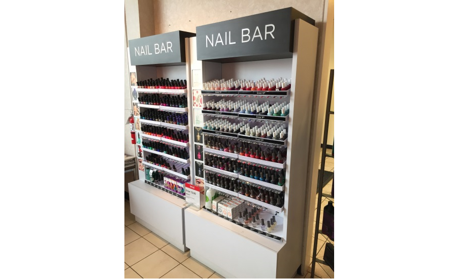 Female shopper choosing nail polish in cosmetics store Stock Photo - Alamy