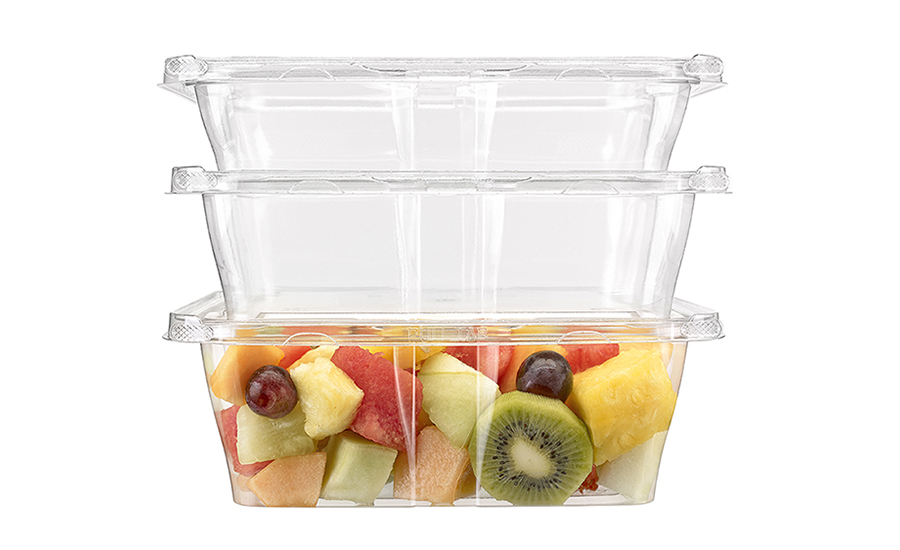A stack of clear plastic containers, the bottom full of mixed fruit