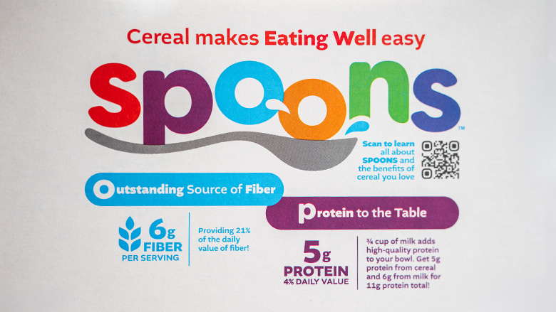 Close-up of SPOONS logo Frosted Mini Wheats